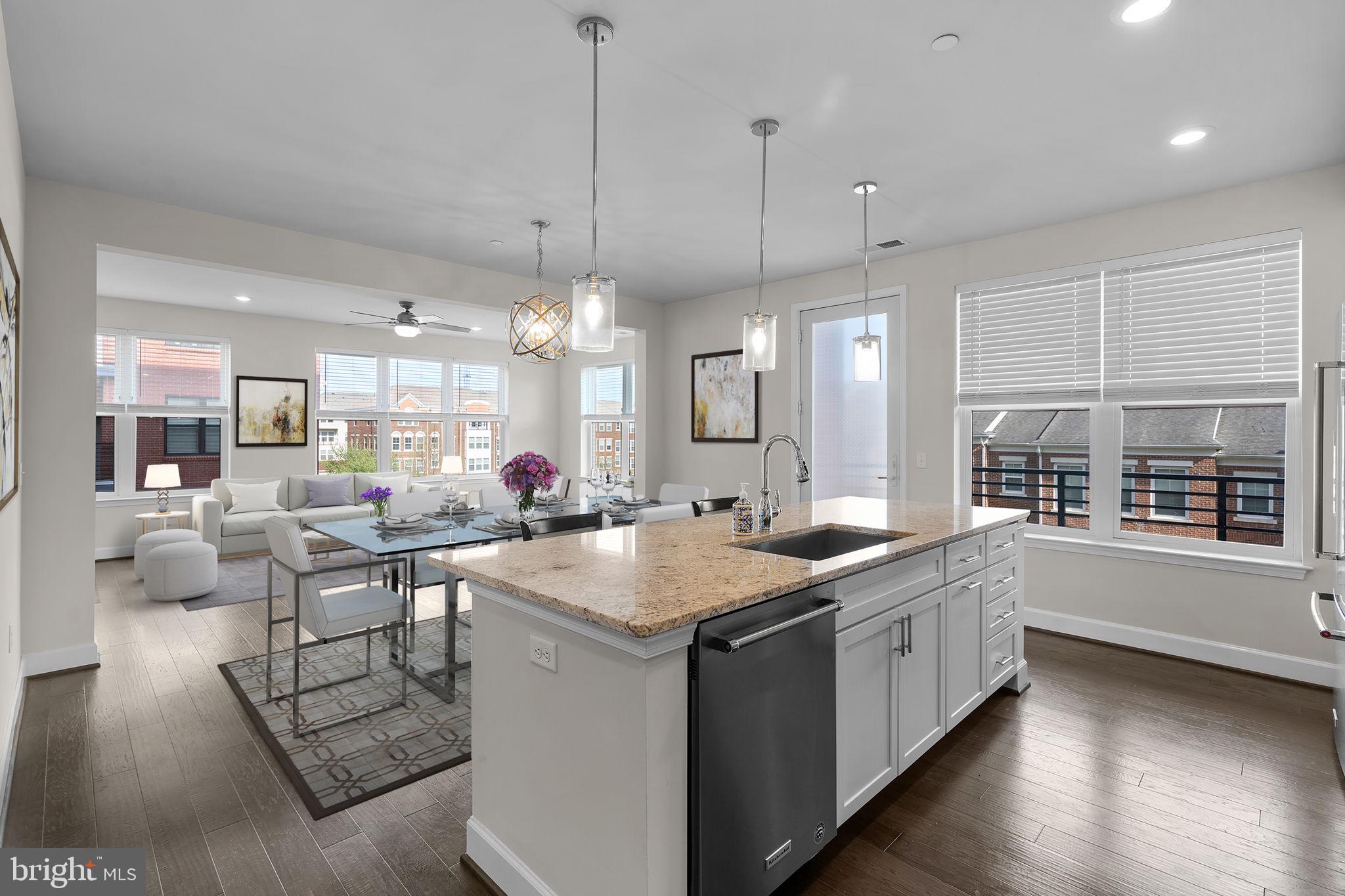 2960 Vaden Drive, Unit 2312 Fairfax, VA 22031 - Photo 10 of 46 a kitchen with stainless steel appliances granite countertop a stove and a wooden floors