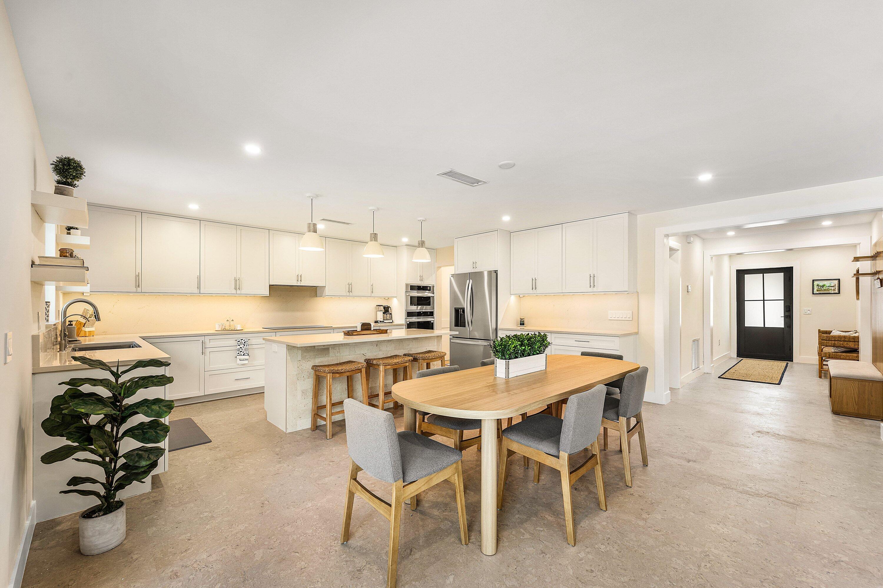 a kitchen with a table and chairs in it
