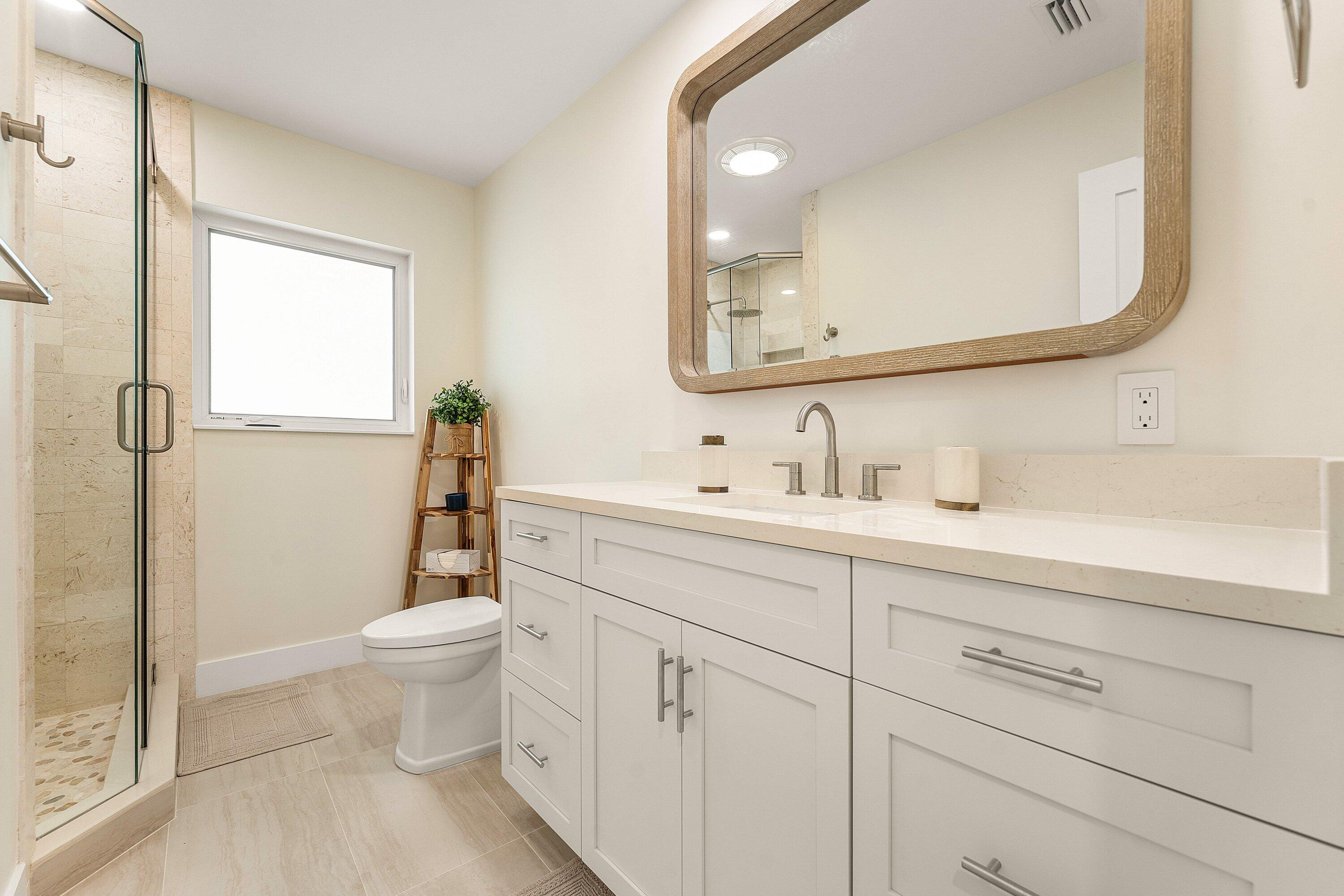 1070 Marble Way Boca Raton, FL 33432 - Photo 11 of 39 a bathroom with a sink a toilet and shower