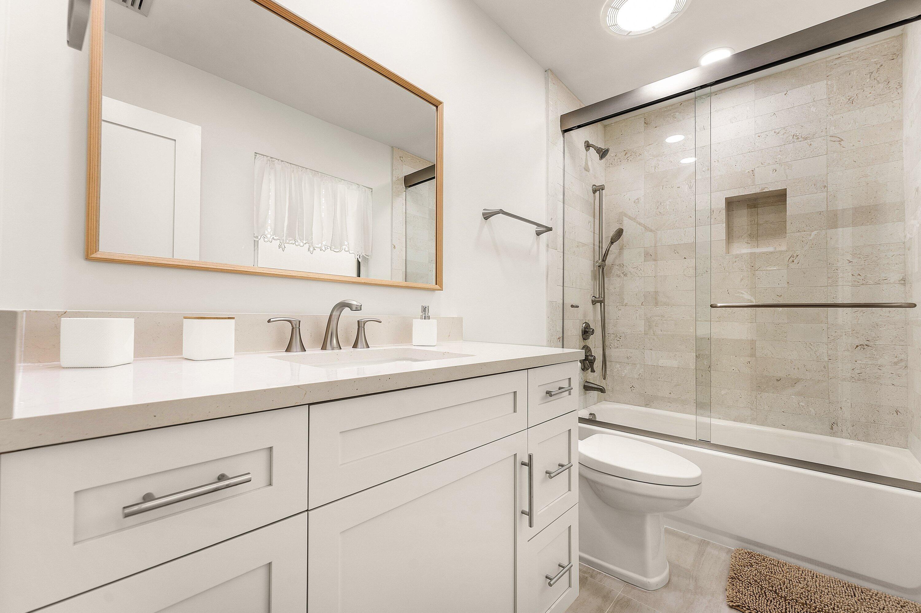 1070 Marble Way Boca Raton, FL 33432 - Photo 20 of 39 a bathroom with a sink a toilet and shower