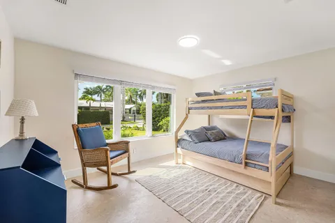 a bedroom with furniture and a window