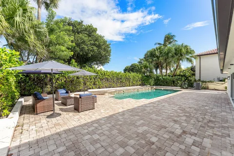 a view of a swimming pool with a patio