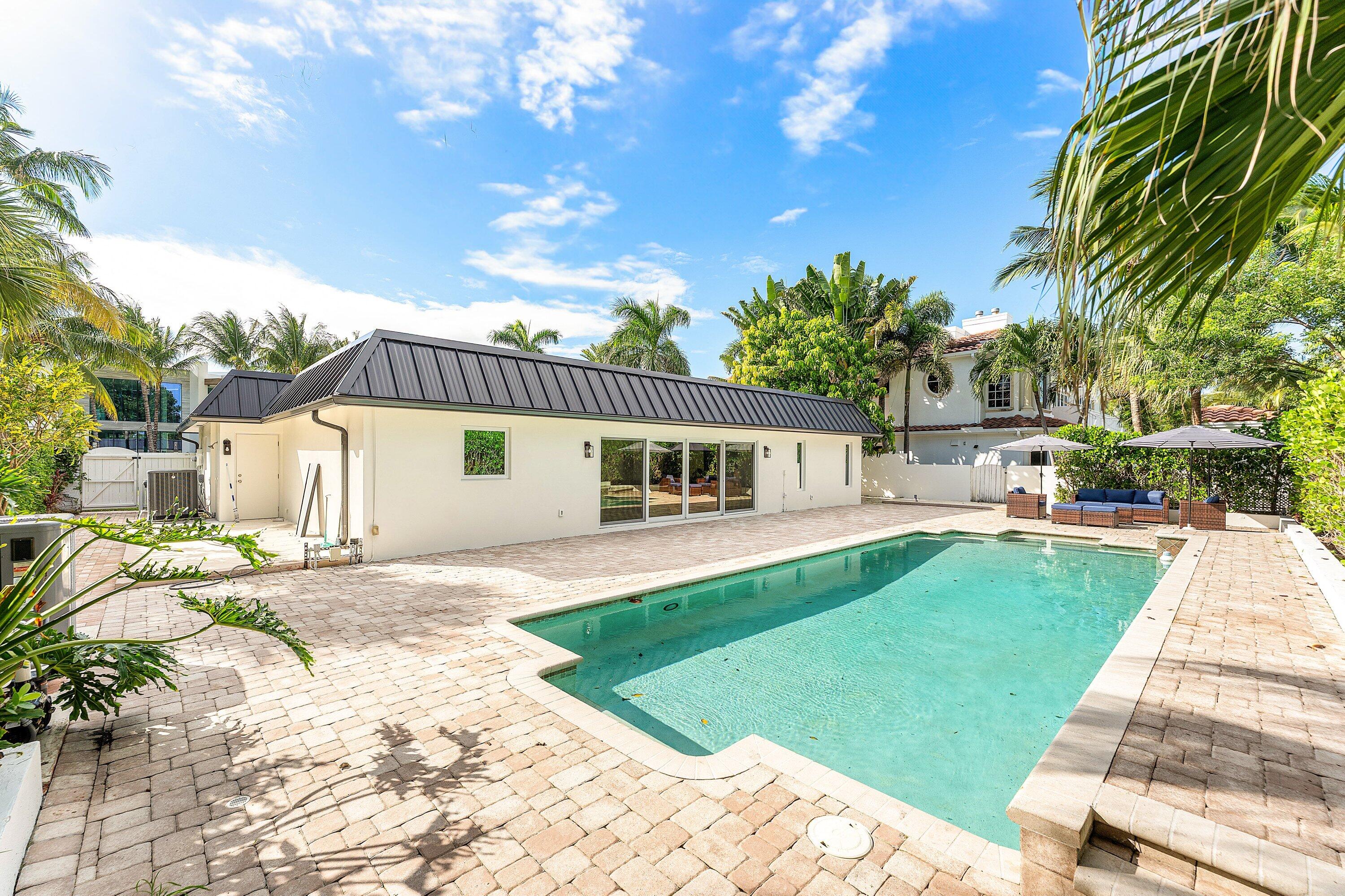 1070 Marble Way Boca Raton, FL 33432 - Photo 33 of 39 a front view of a house with garden