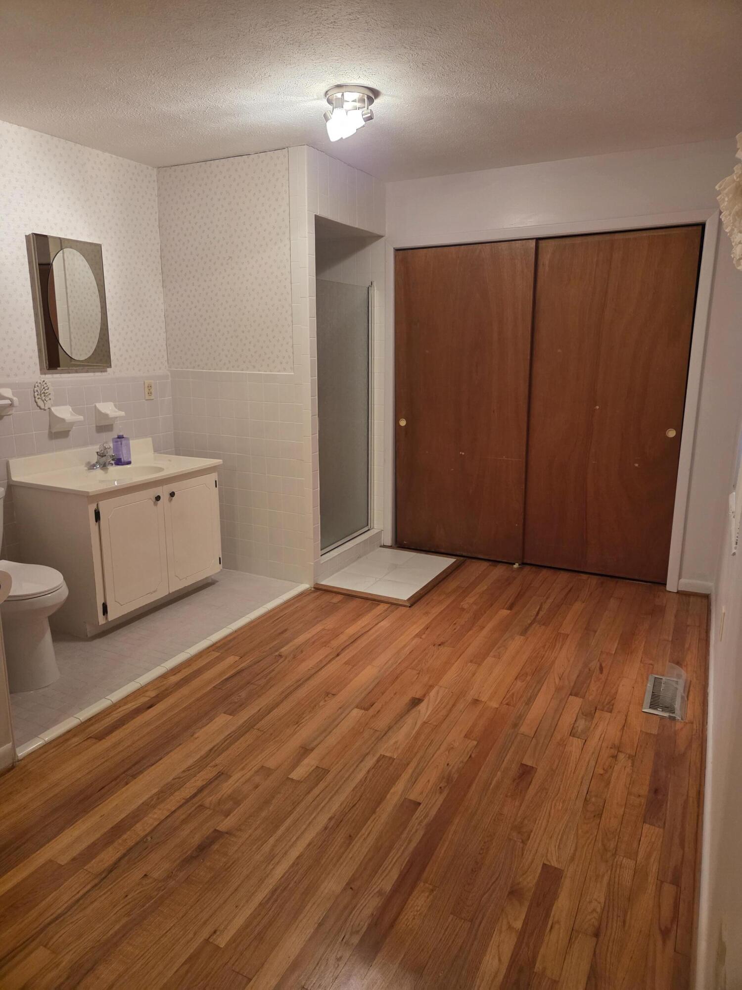 814 Maple Street Chipley, FL 32428 - Photo 13 of 15 a view of a room with wooden floor and cabinet