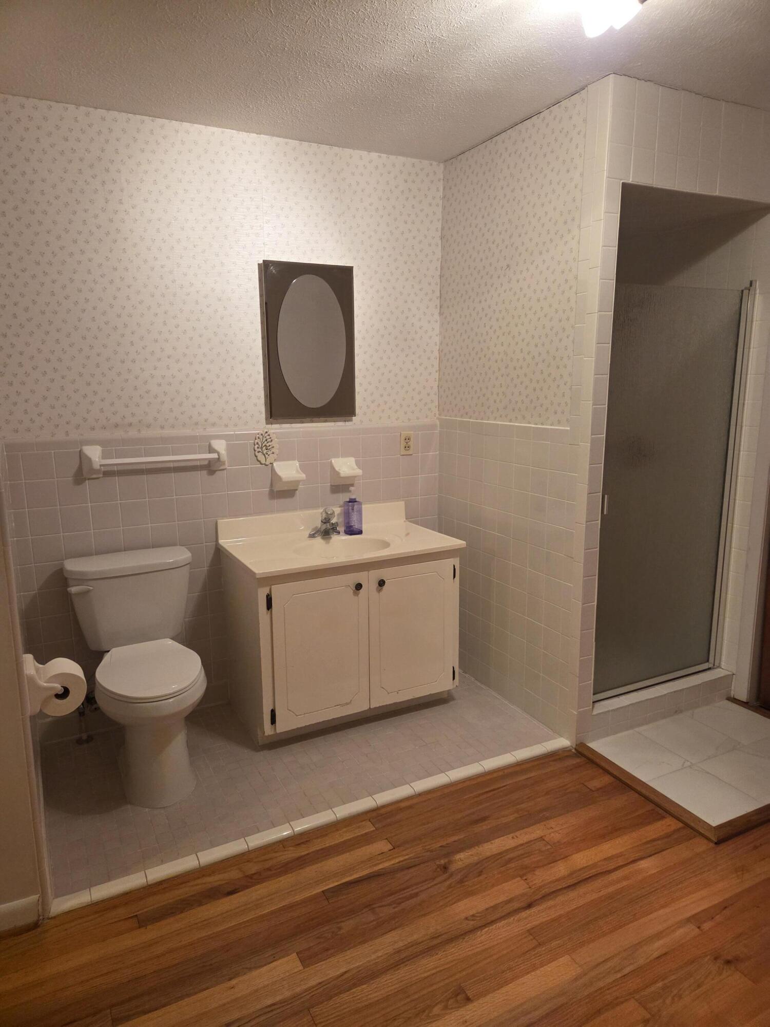 814 Maple Street Chipley, FL 32428 - Photo 15 of 15 a bathroom with a sink mirror vanity and toilet