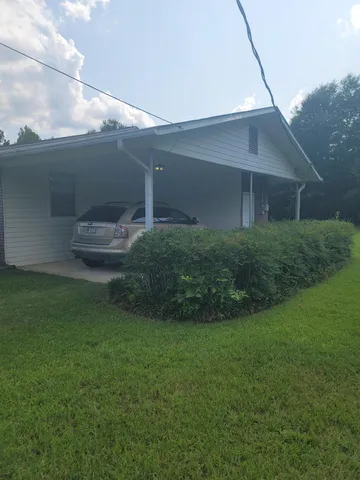 a view of a backyard of the house