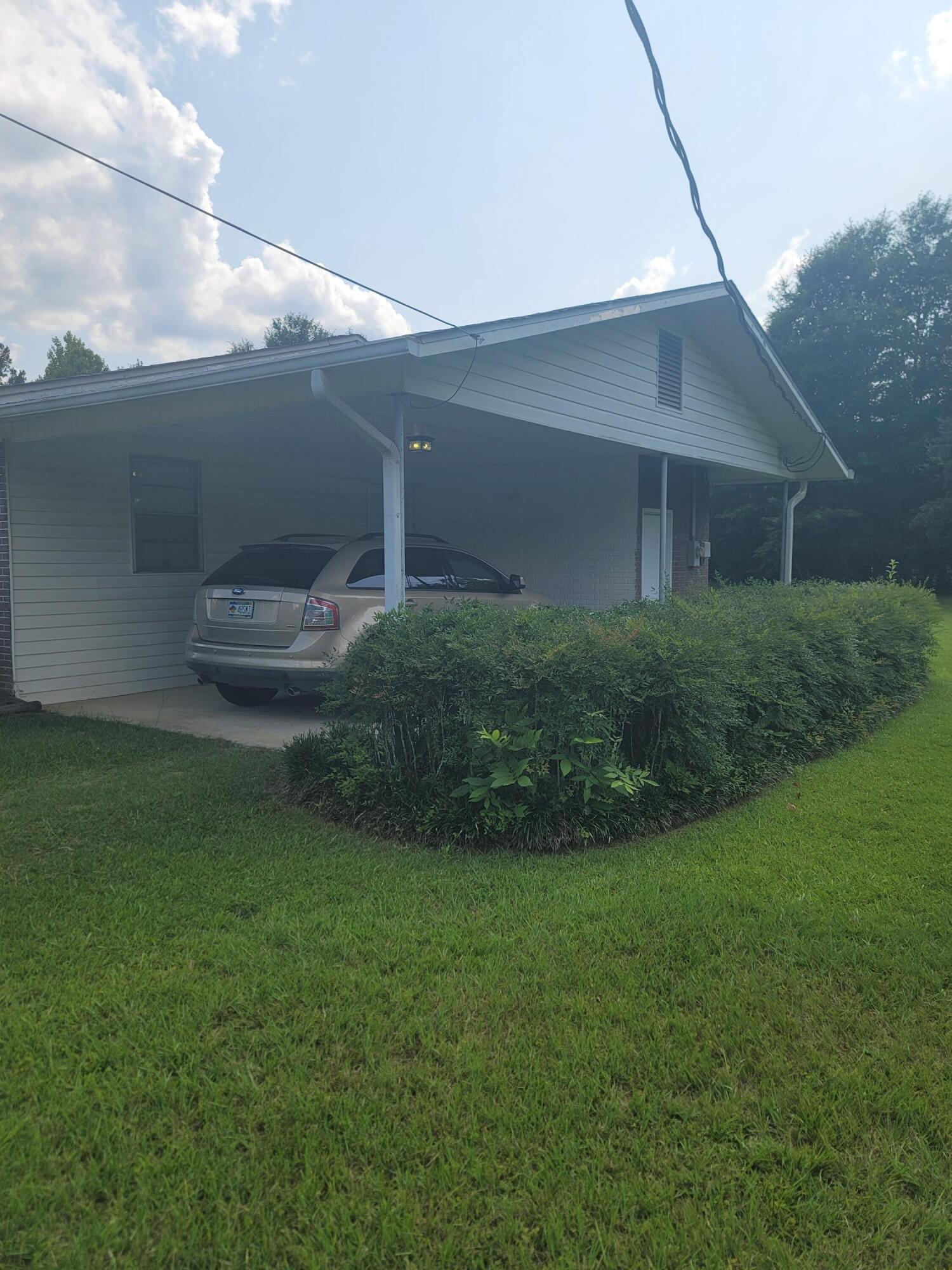 814 Maple Street Chipley, FL 32428 - Photo 5 of 15 a view of a backyard of the house