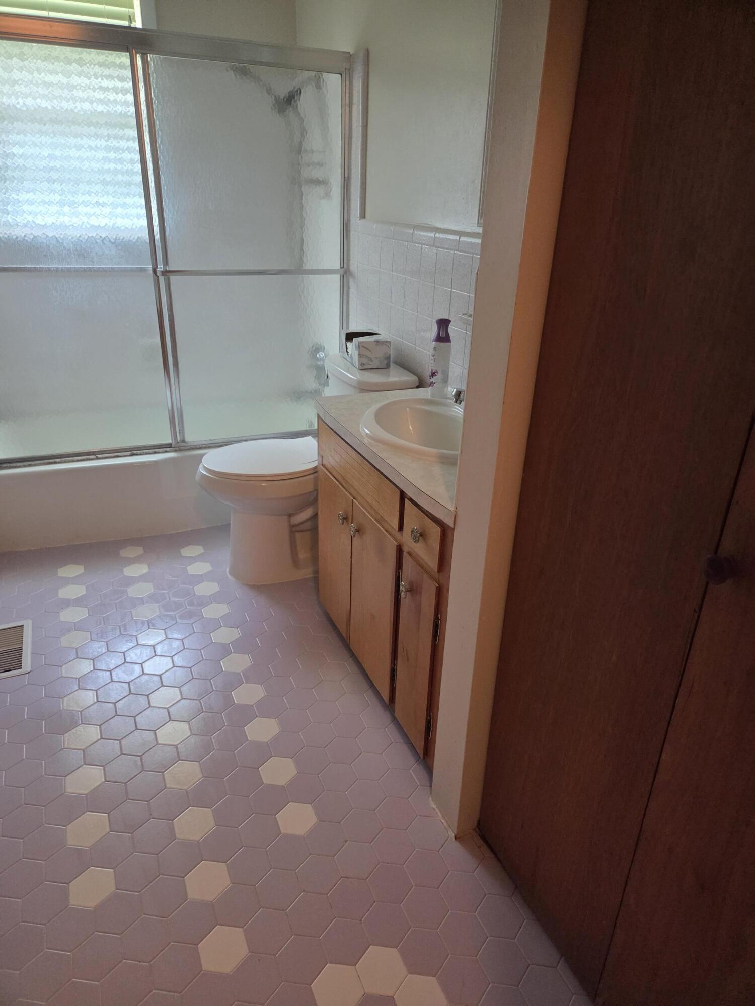 814 Maple Street Chipley, FL 32428 - Photo 6 of 15 a bathroom with a sink and a vanity