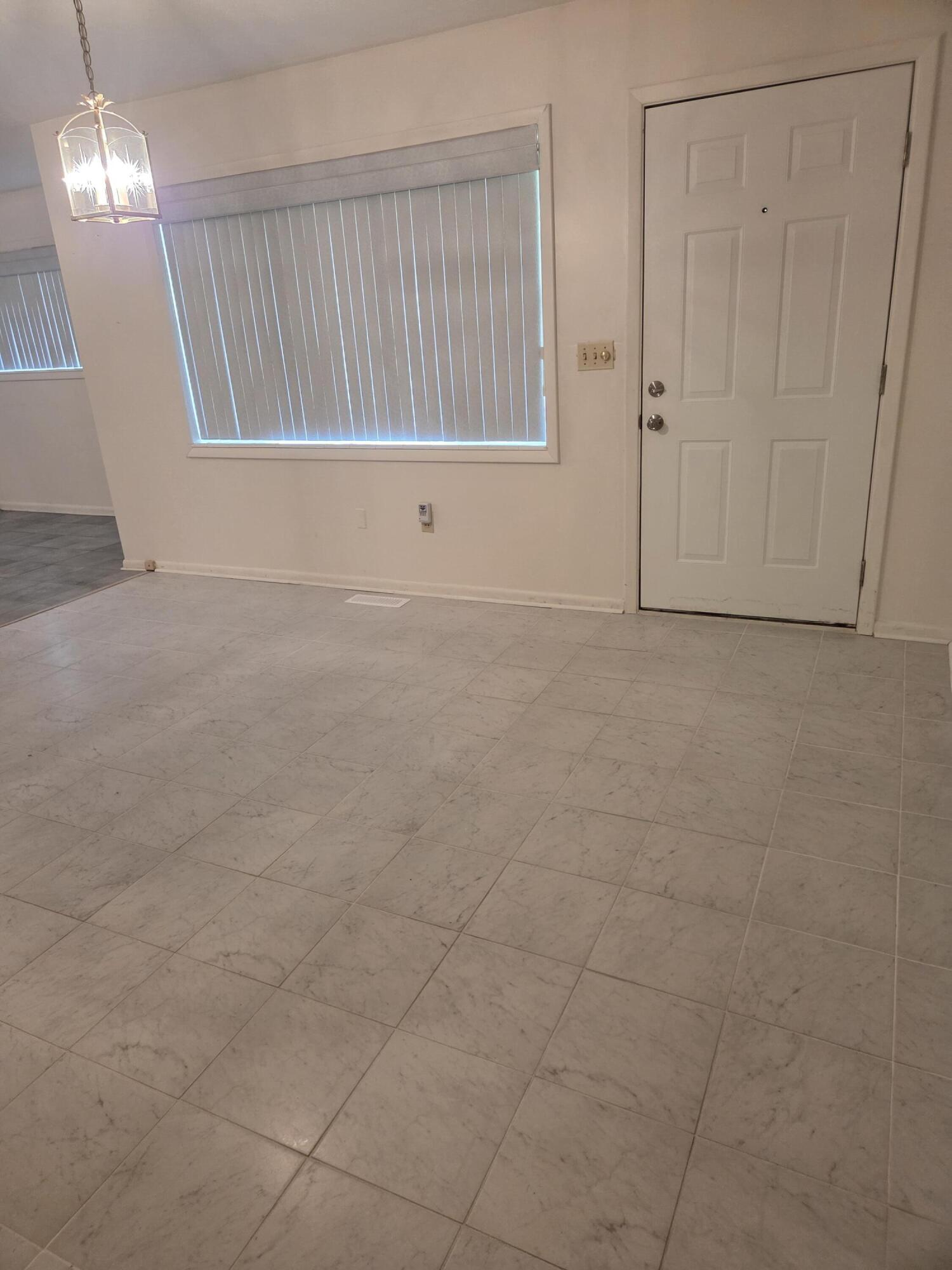 814 Maple Street Chipley, FL 32428 - Photo 7 of 15 a view of an empty room with a window