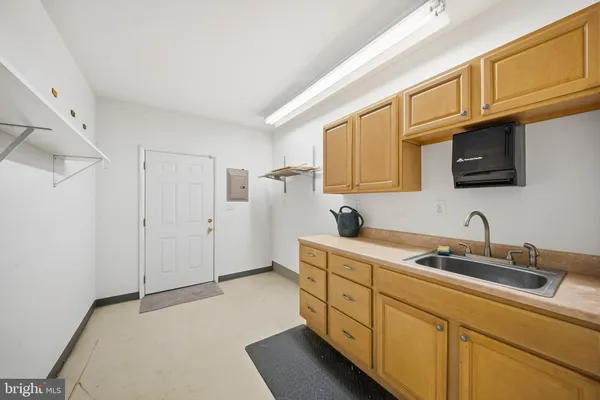a kitchen with stainless steel appliances granite countertop a sink stove and microwave