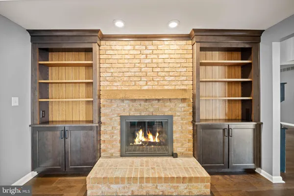 a bedroom with a bed and a fireplace