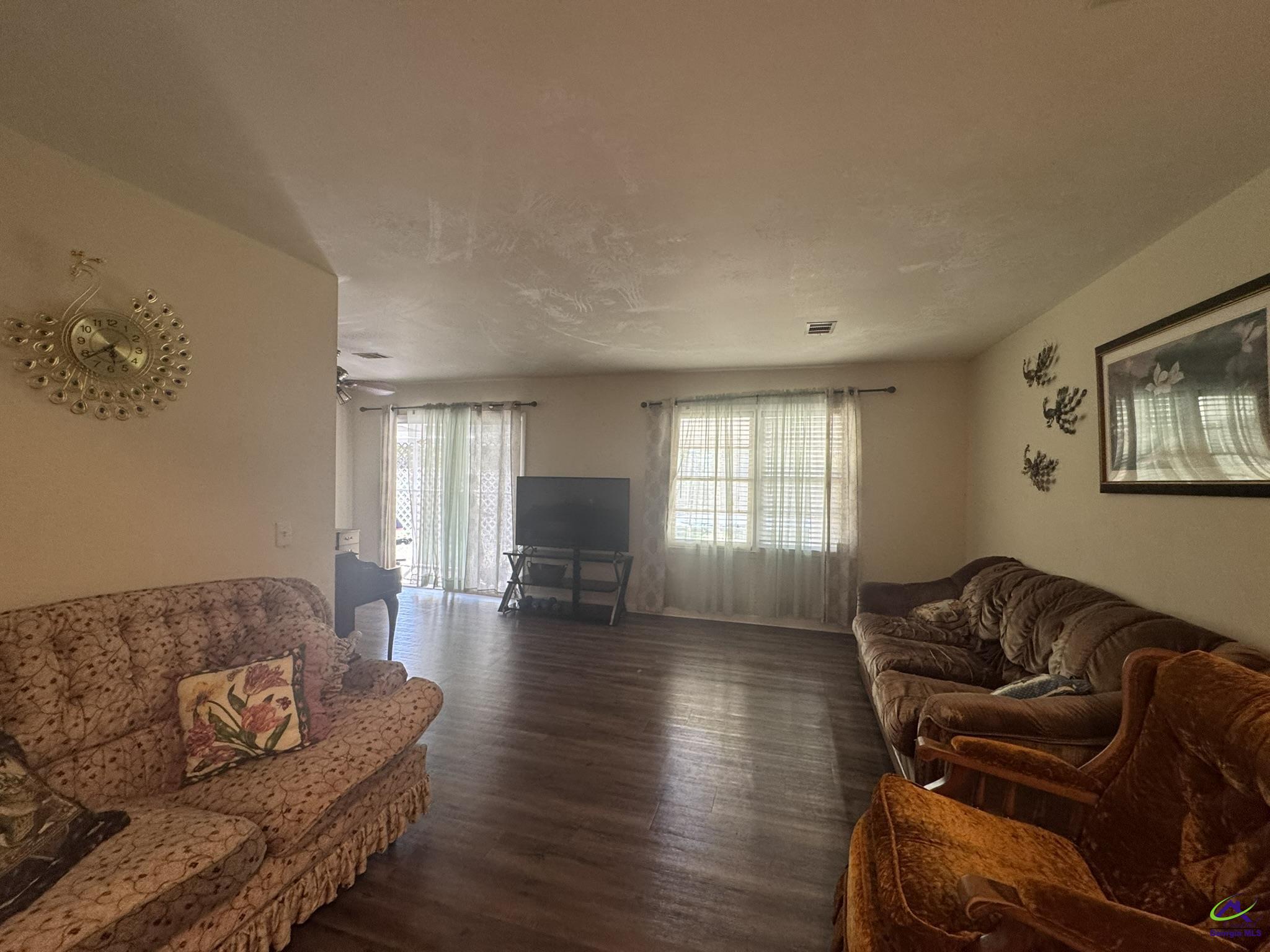 1032 Elberta Road Warner Robins, GA 31093 - Photo 20 of 26 a living room with furniture and wooden floor