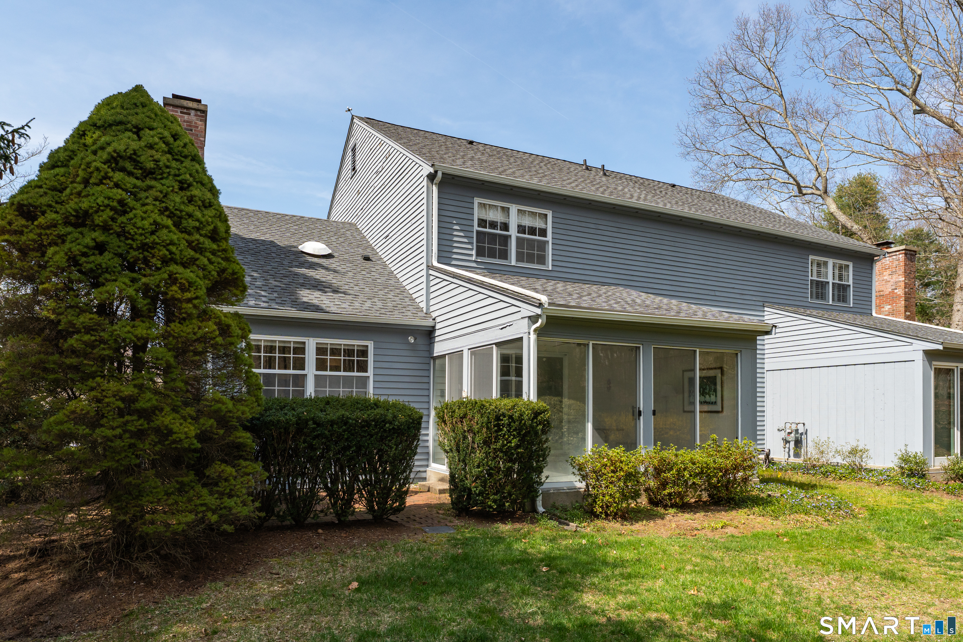 23 Hampshire Road, Unit 23 Madison, CT 06443 - Photo 37 of 39 Backyard with sunroom and private patio