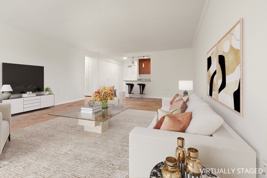 2 Hawthorne Place, Unit 5H Boston, MA 02114 - Photo 13 of 21 a living room with furniture and a flat screen tv