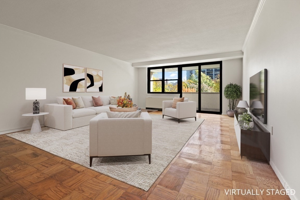 2 Hawthorne Place, Unit 5H Boston, MA 02114 - Photo 8 of 21 a living room with furniture and large windows
