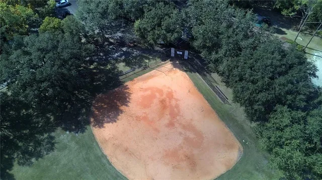 a view of a swimming pool with a yard