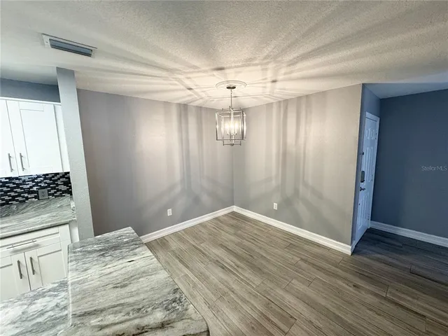 a view of a livingroom with wooden floor