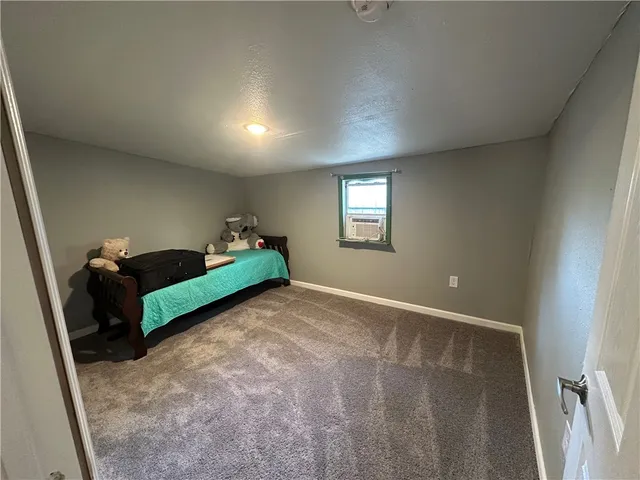 a bathroom with a sink a toilet and a shower