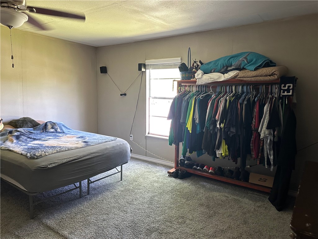 409 Houston Street Mexia, TX 76667 - Photo 19 of 33 a bedroom with a bed and a window