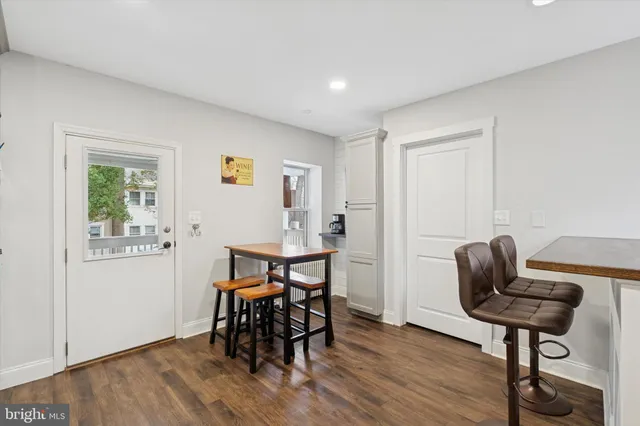 a view of a livingroom with furniture and wooden floor