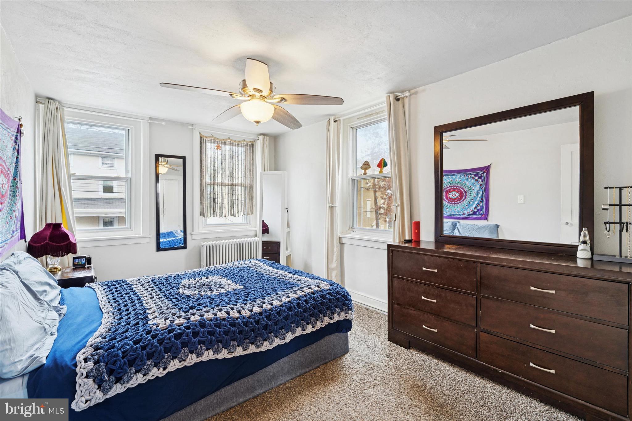138 Hall Street Spring City, PA 19475 - Photo 14 of 25 a bedroom with a bed and a dresser