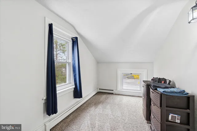 a view of an empty room and a window