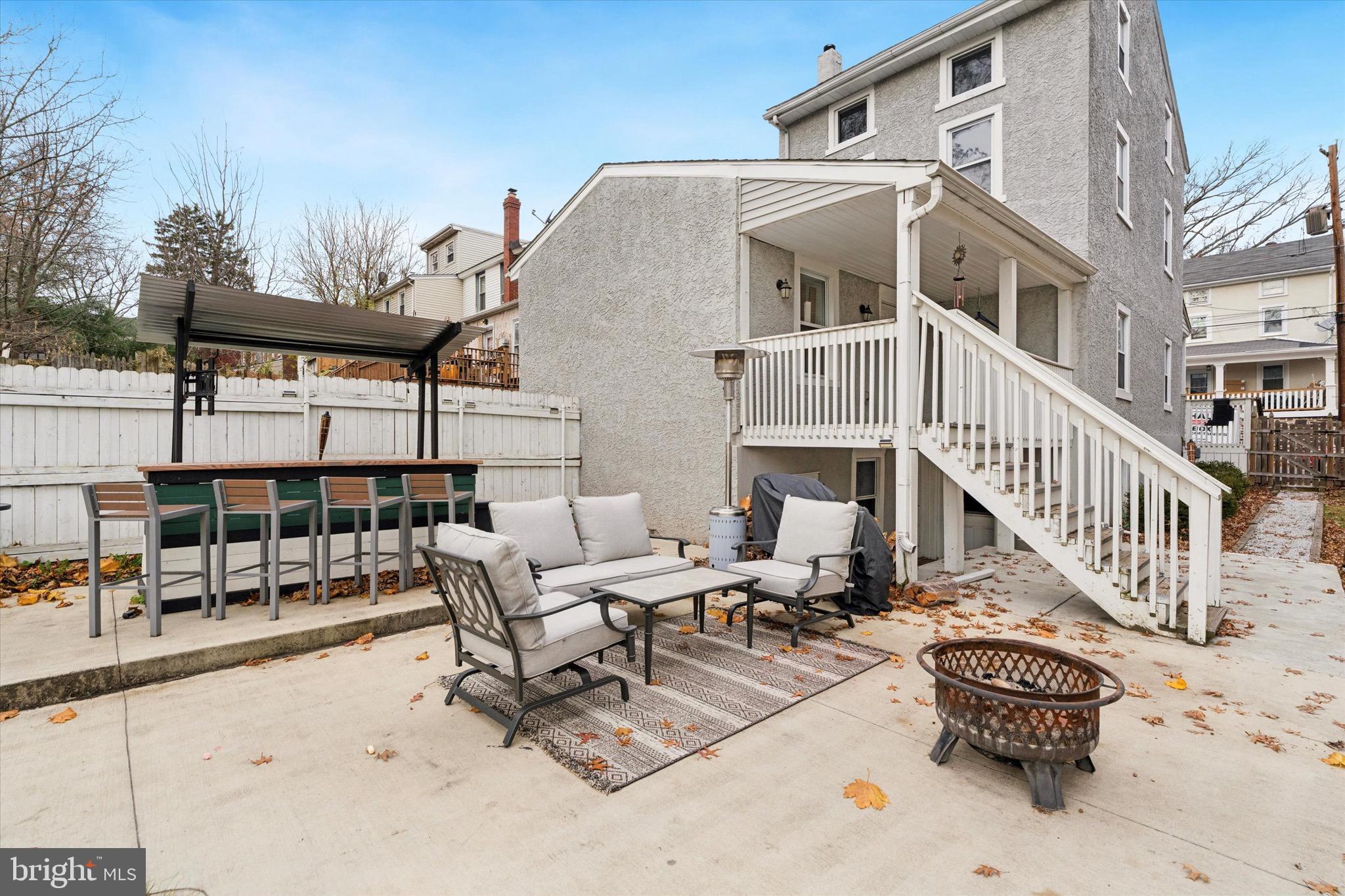 138 Hall Street Spring City, PA 19475 - Photo 24 of 25 a view of a patio with couches table and chairs and potted plants