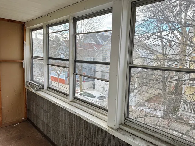 a view of a glass door with a tree