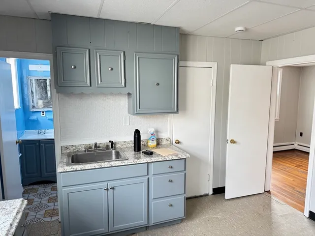 a kitchen with stainless steel appliances granite countertop a refrigerator sink and cabinets