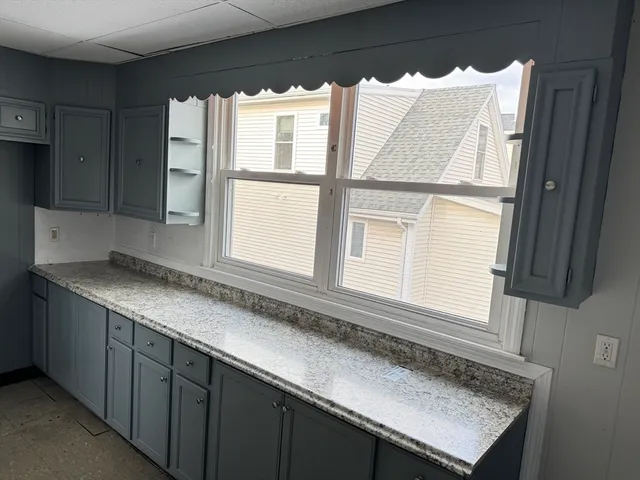a kitchen with a sink and a window