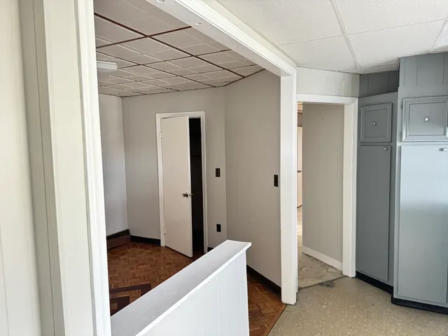 a view of a room that has a bed in it