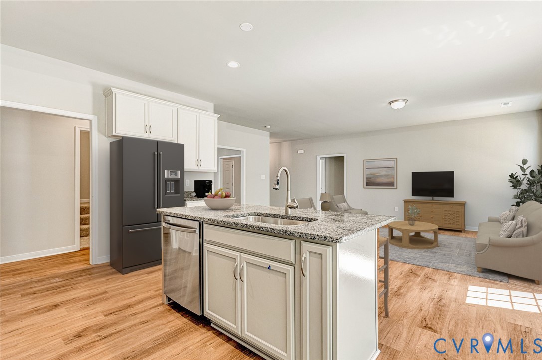 8355 Patrick Henry Boulevard Mechanicsville, VA 23116 - Photo 11 of 48 a kitchen with stainless steel appliances granite countertop a refrigerator and a stove top oven