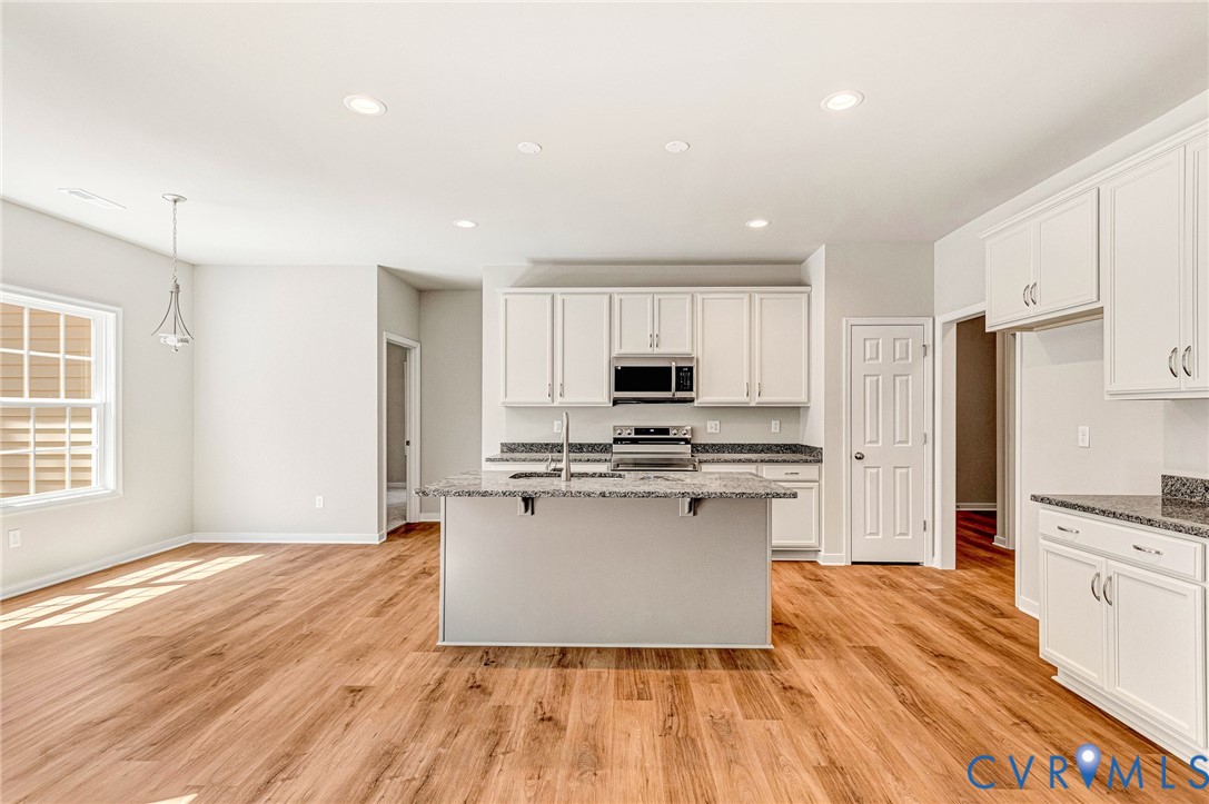 8355 Patrick Henry Boulevard Mechanicsville, VA 23116 - Photo 17 of 48 a kitchen with stainless steel appliances a refrigerator sink and microwave
