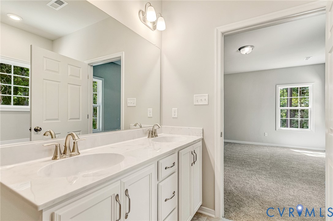 8355 Patrick Henry Boulevard Mechanicsville, VA 23116 - Photo 31 of 48 a bathroom with a sink double vanity and a mirror