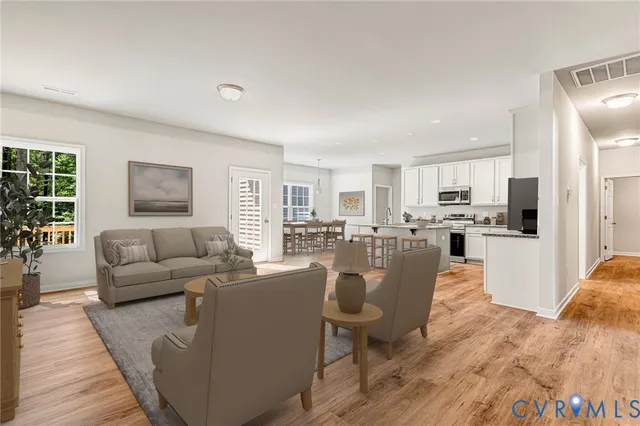 a view of empty room with wooden floor and window