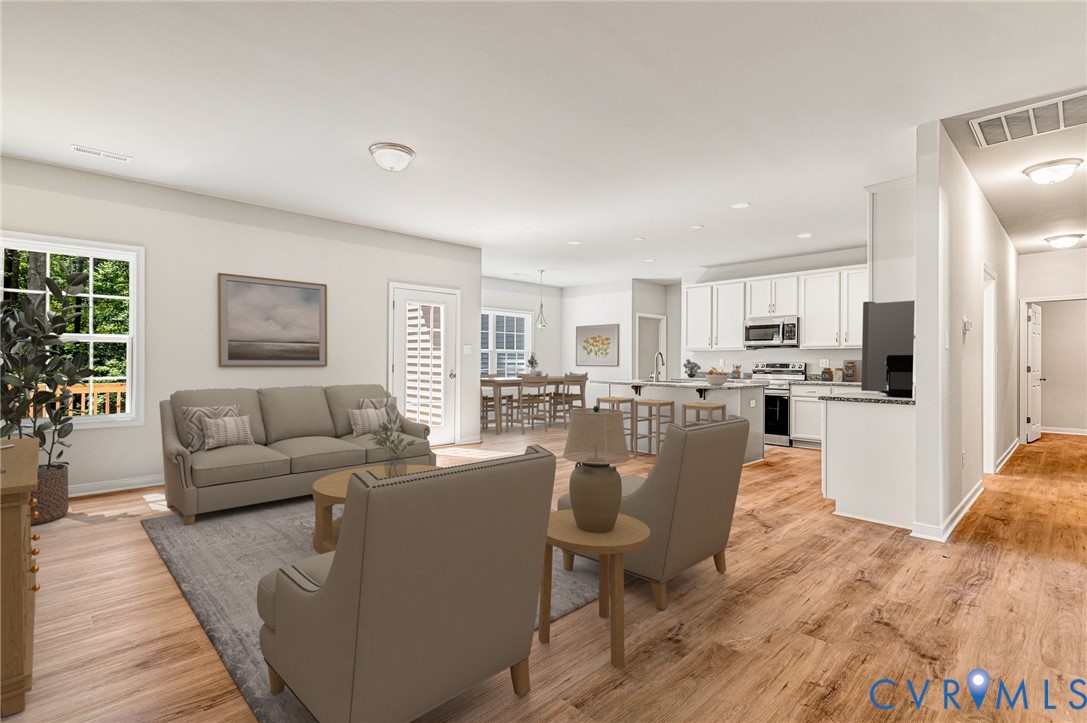 8355 Patrick Henry Boulevard Mechanicsville, VA 23116 - Photo 7 of 48 Virtually staged - Living area with light wood-sty