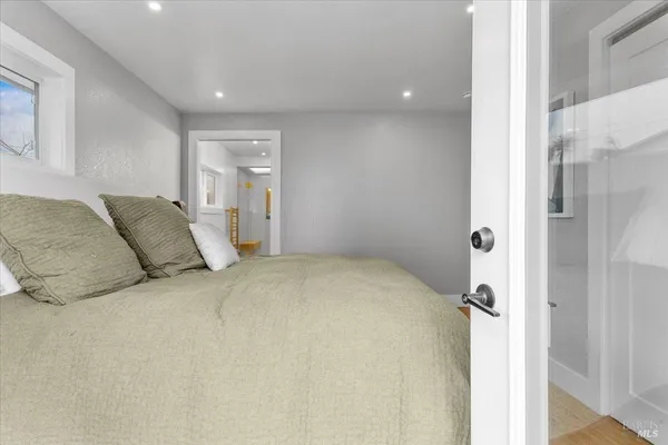 a bed room with a bed and a painting