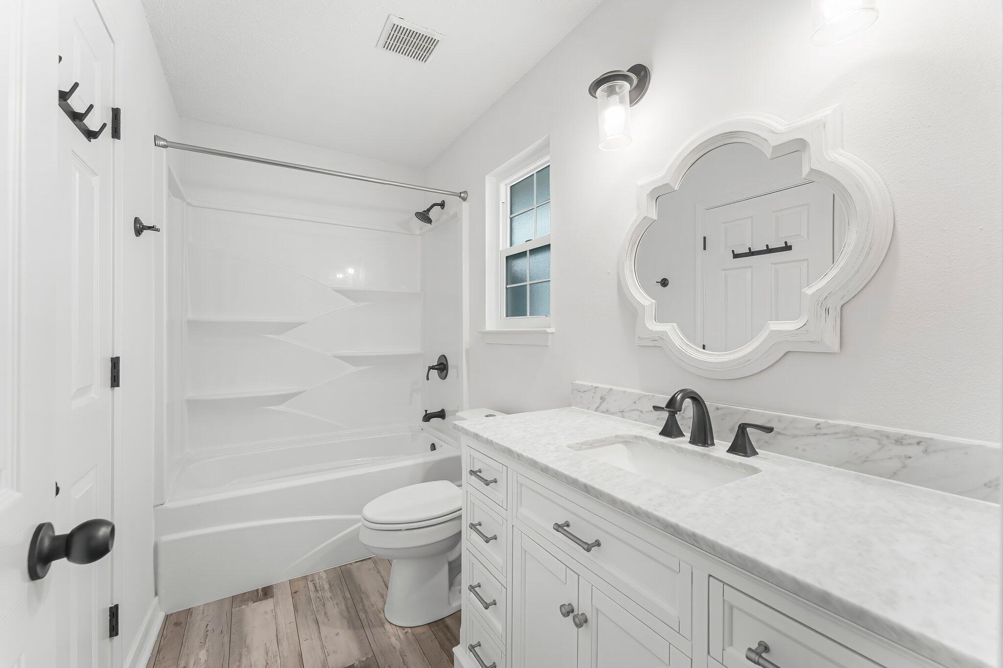 162 Beacon Way Santa Rosa Beach, FL 32459 - Photo 25 of 41 a bathroom with a sink a toilet and a mirror
