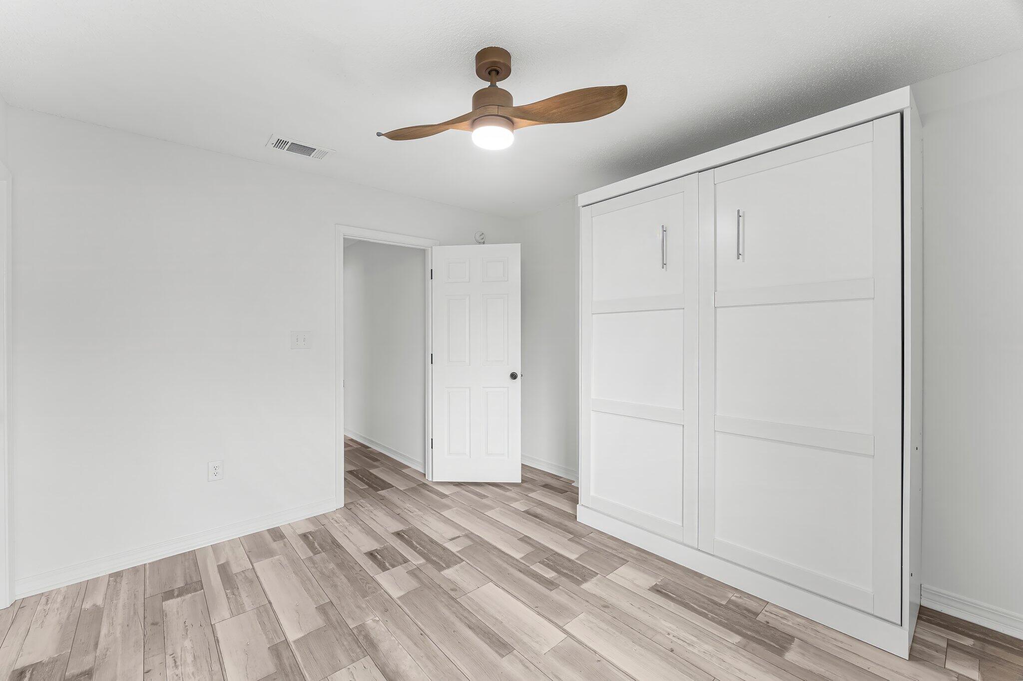 162 Beacon Way Santa Rosa Beach, FL 32459 - Photo 27 of 41 a view of empty room with ceiling fan