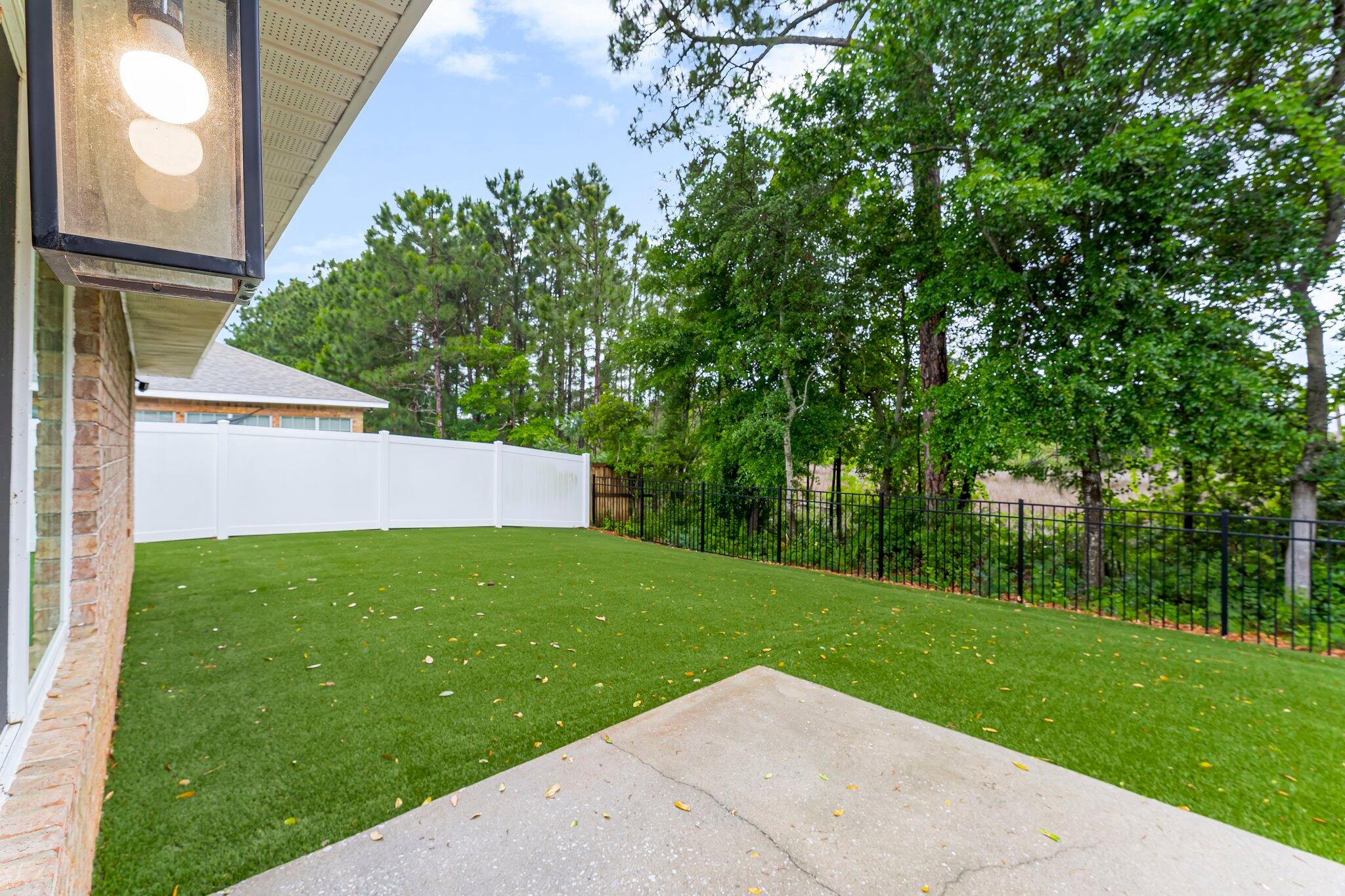 162 Beacon Way Santa Rosa Beach, FL 32459 - Photo 29 of 41 a view of a backyard with large trees