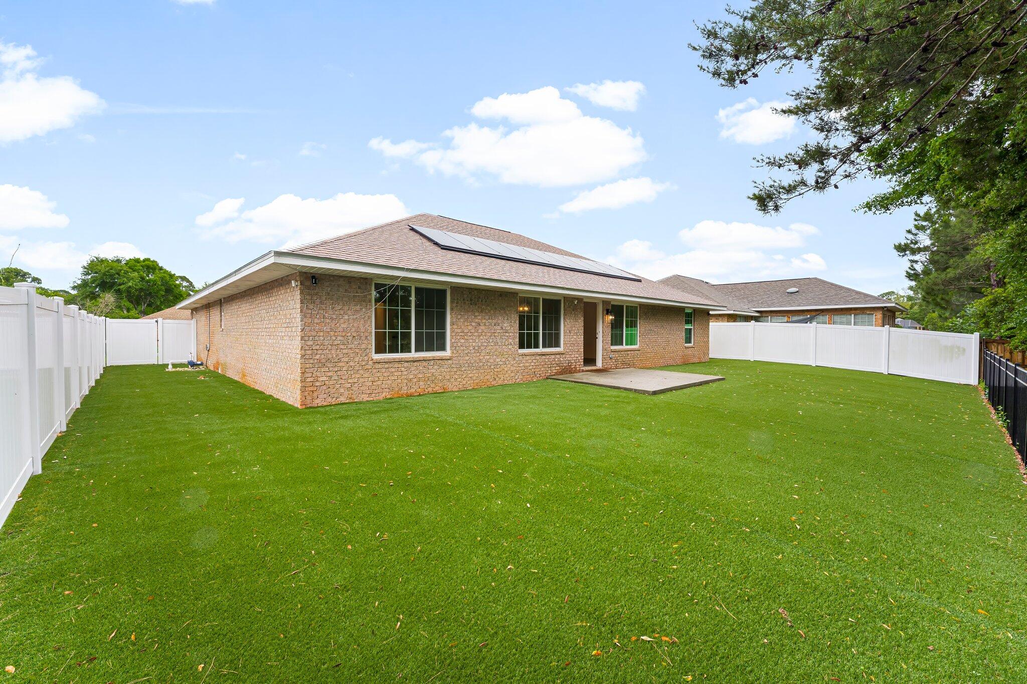 162 Beacon Way Santa Rosa Beach, FL 32459 - Photo 30 of 41 a view of an house with backyard space and garden