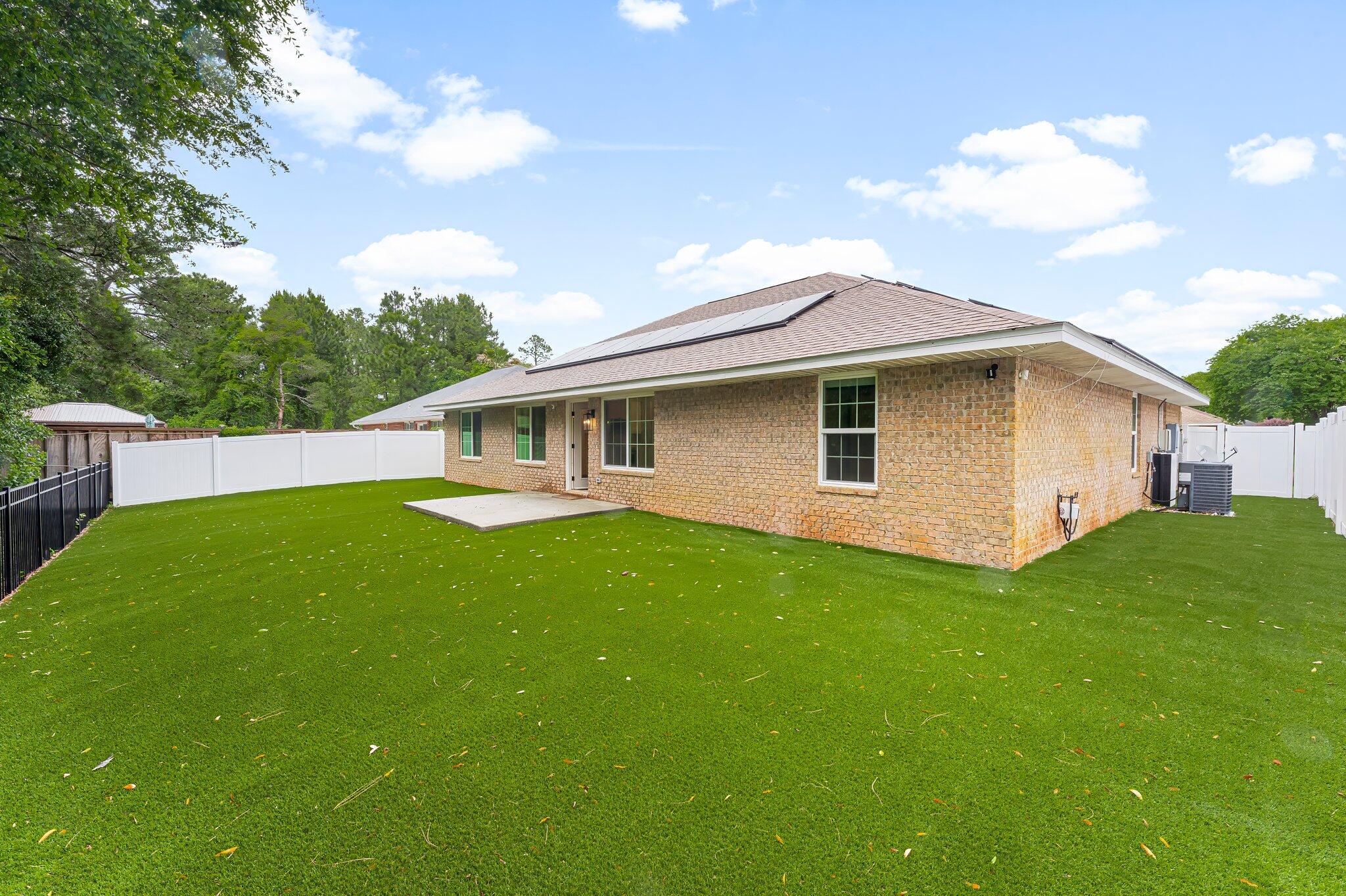 162 Beacon Way Santa Rosa Beach, FL 32459 - Photo 31 of 41 a view of a house with backyard and garden