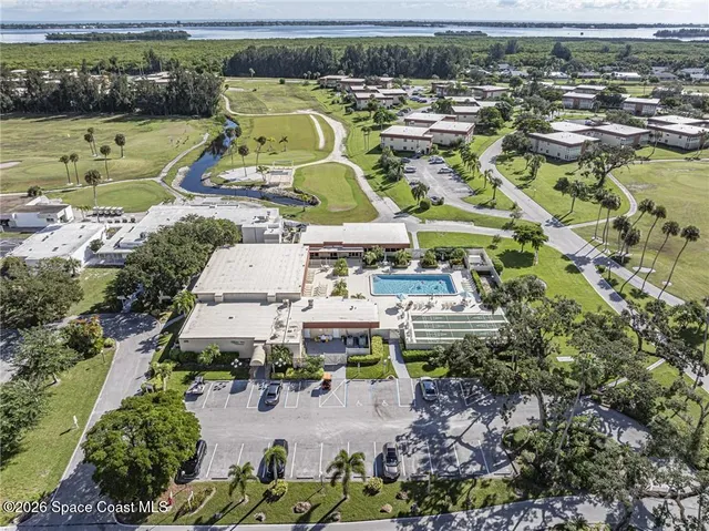 an aerial view of a house with a swimming pool yard and outdoor seating