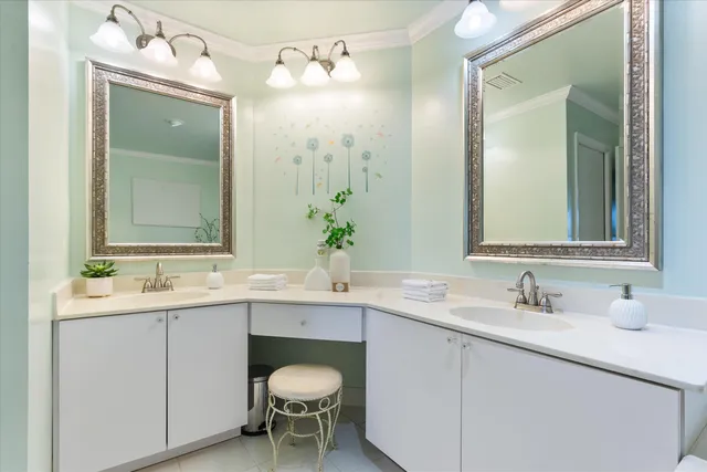a bathroom with a sink vanity and a mirror
