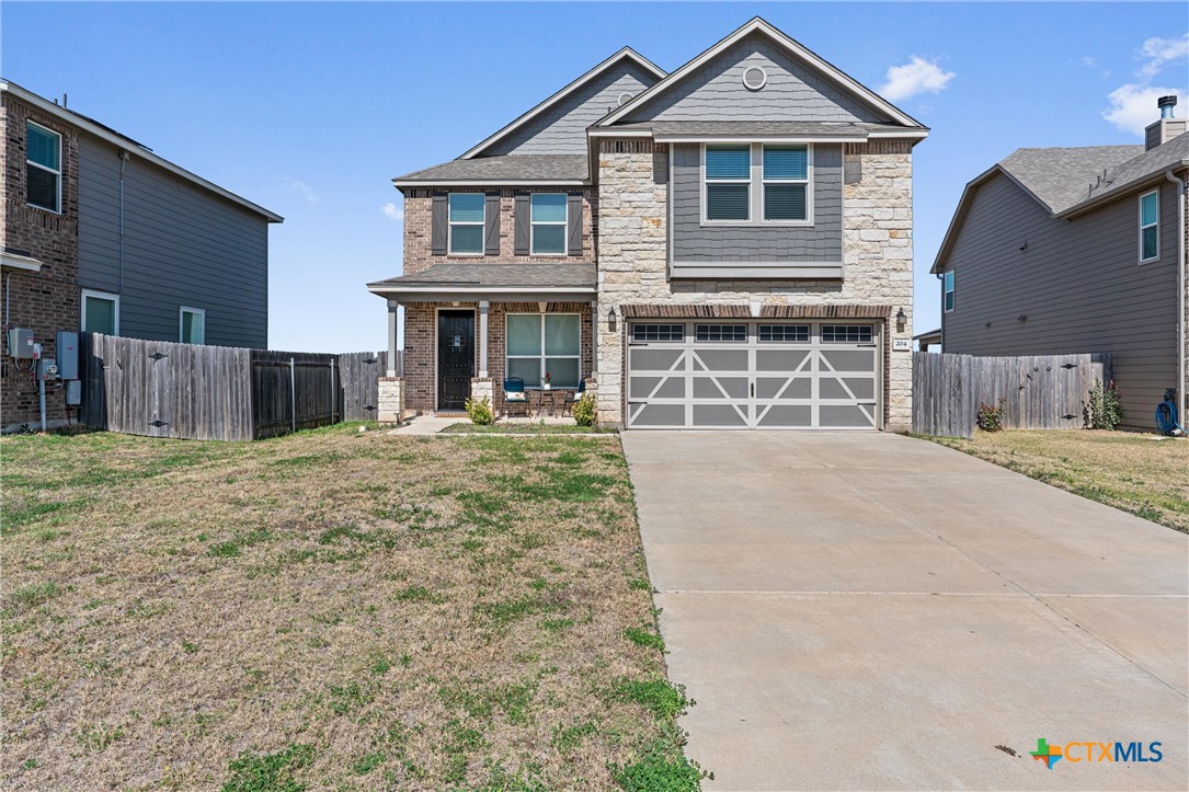 204 Benmyrtle Trail Georgetown, TX 78626 - Photo 1 of 35 a front view of a house with a yard and garage
