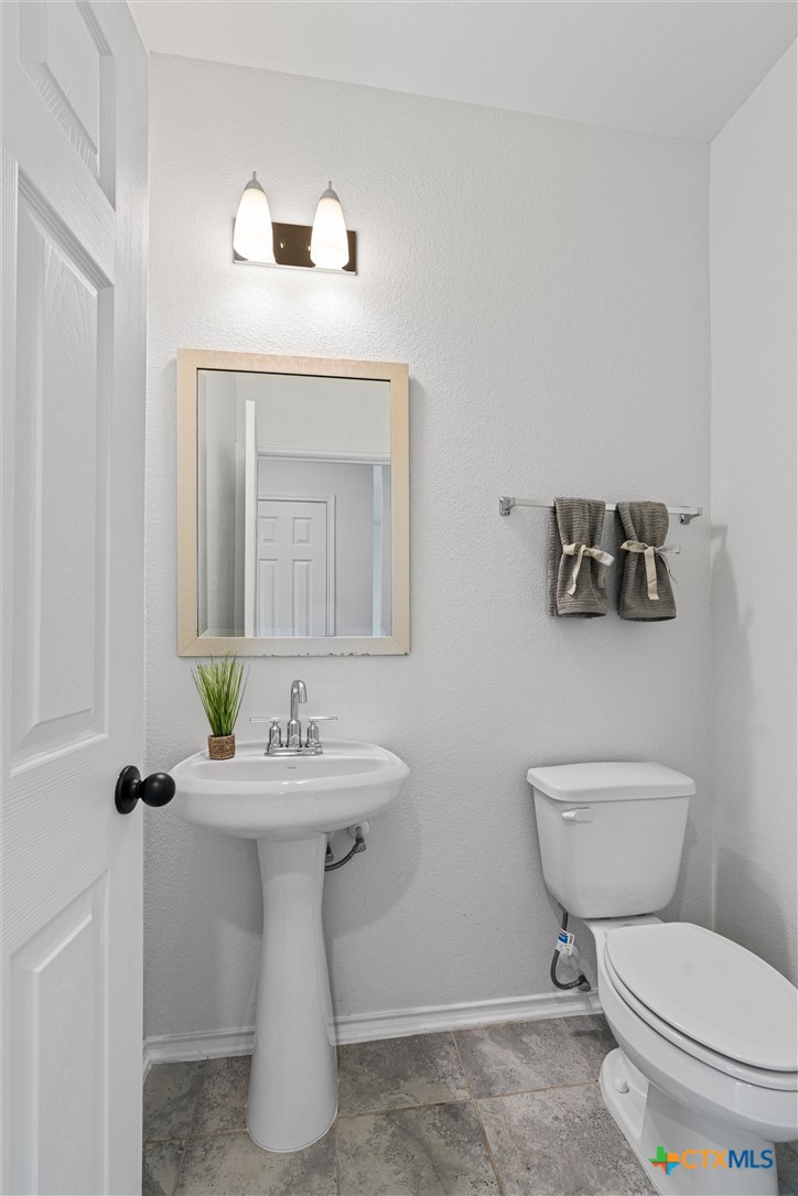 204 Benmyrtle Trail Georgetown, TX 78626 - Photo 18 of 35 a bathroom with a sink toilet and mirror