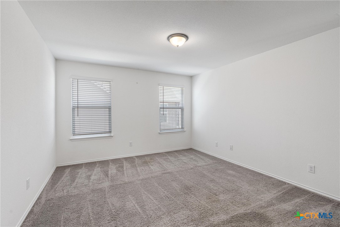 204 Benmyrtle Trail Georgetown, TX 78626 - Photo 19 of 35 an empty room with windows