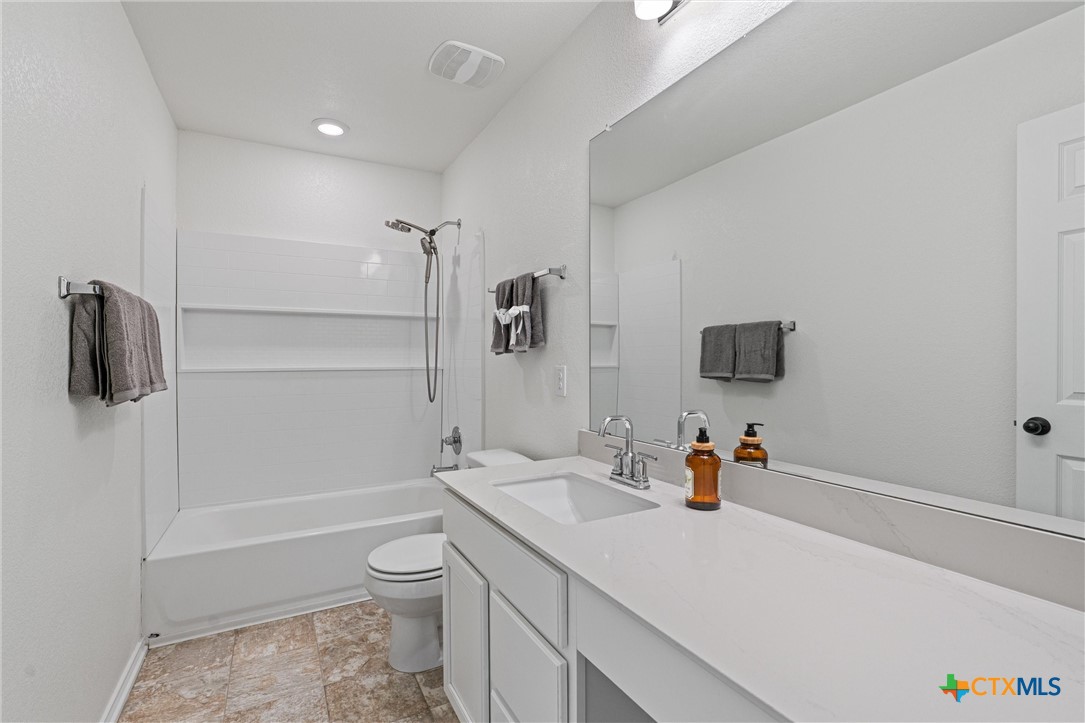 204 Benmyrtle Trail Georgetown, TX 78626 - Photo 28 of 35 a bathroom with a sink a toilet and shower