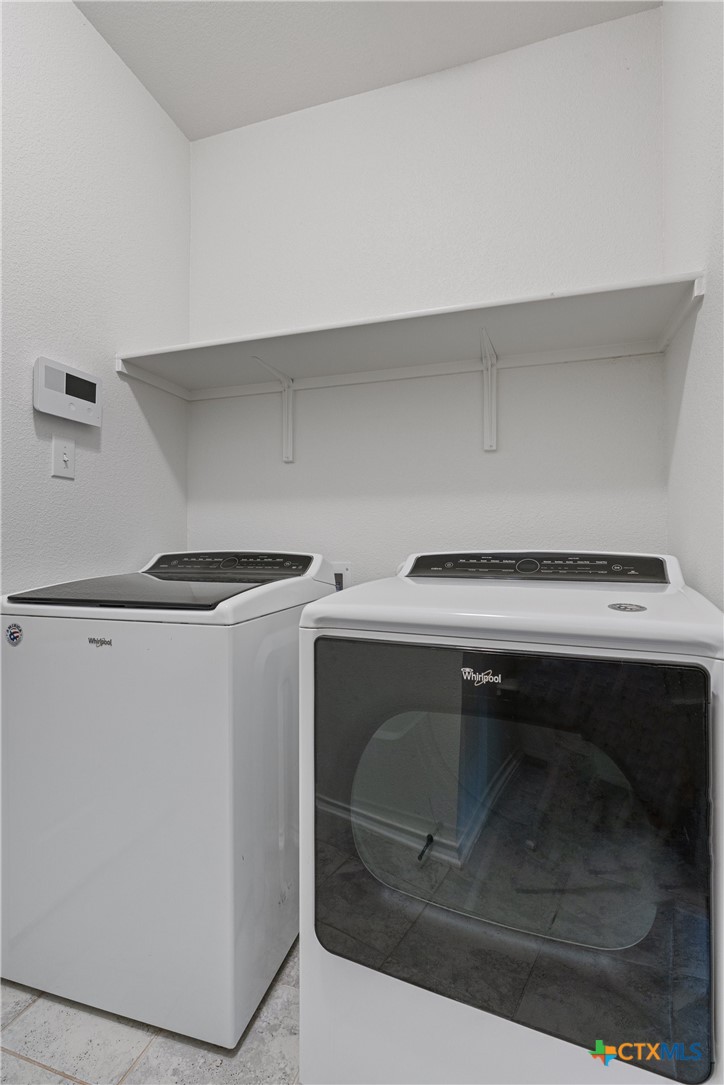 204 Benmyrtle Trail Georgetown, TX 78626 - Photo 31 of 35 a utility room with washing machine