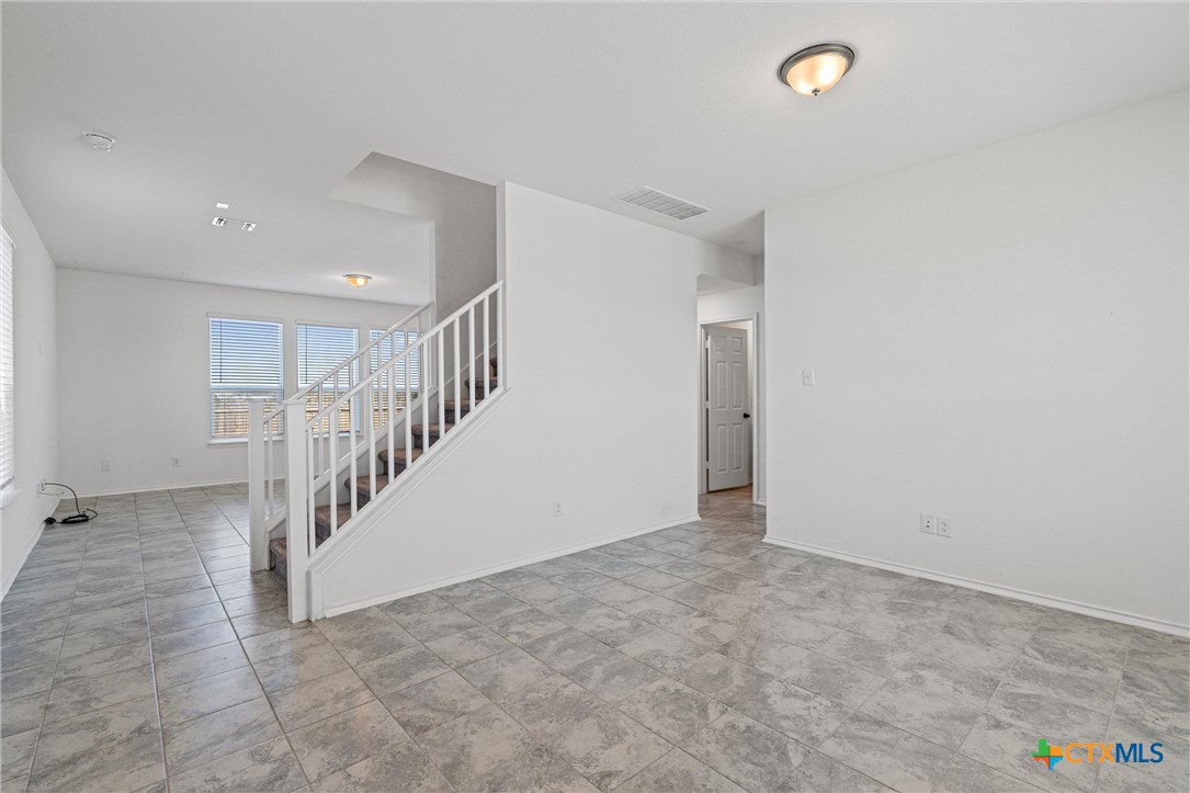 204 Benmyrtle Trail Georgetown, TX 78626 - Photo 5 of 35 a view of an empty room with stairs